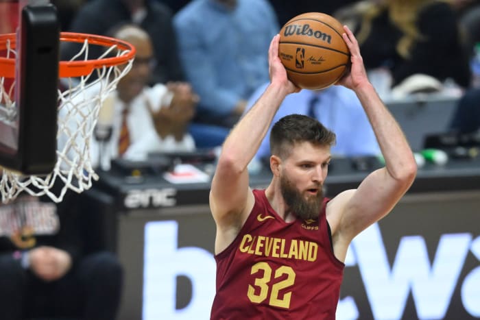 Dec 20, 2023; Cleveland, Ohio, USA; Cleveland Cavaliers forward Dean Wade (32) rebounds in the first quarter against the Utah Jazz at Rocket Mortgage FieldHouse. Mandatory Credit: David Richard-USA TODAY Sports